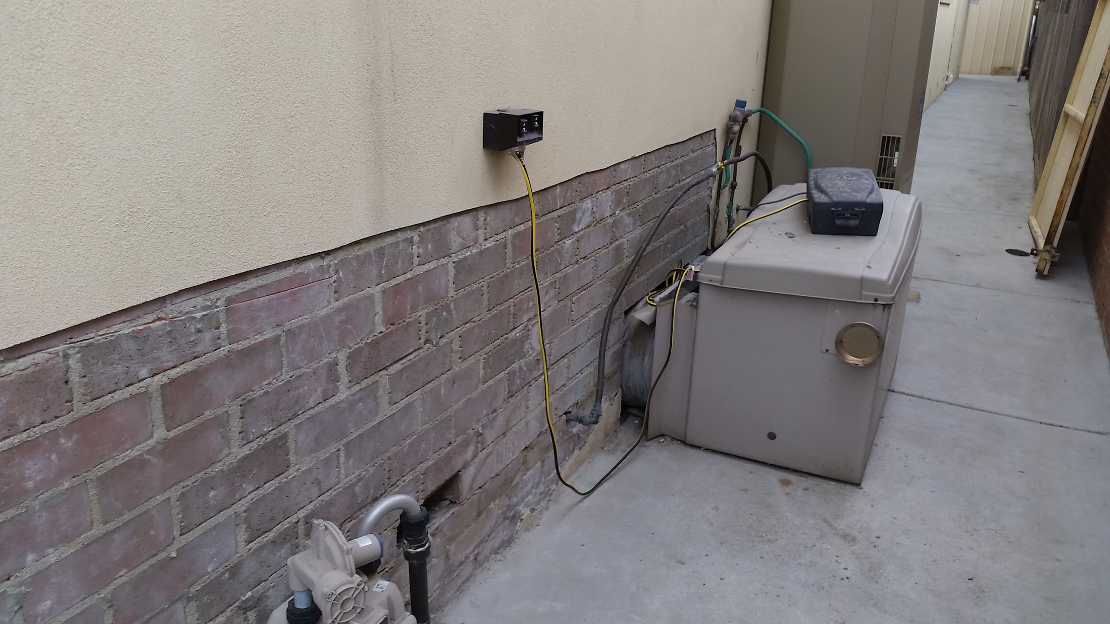 Failed render removed to expose substrate during South Morang remedial works