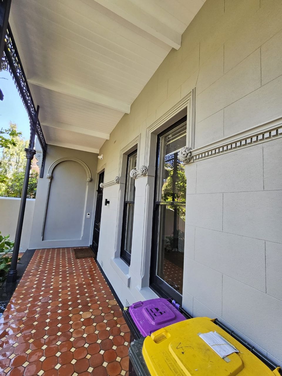 Restored Brunswick heritage verandah with recreated ashlar coursing and moulded window surrounds