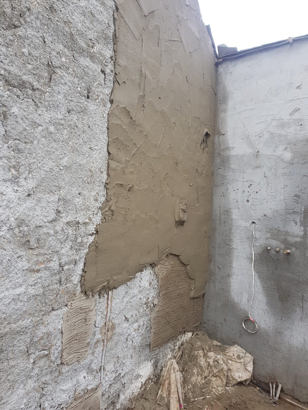 Localised render patch repairs and substrate levelling at Rosehill Homestead