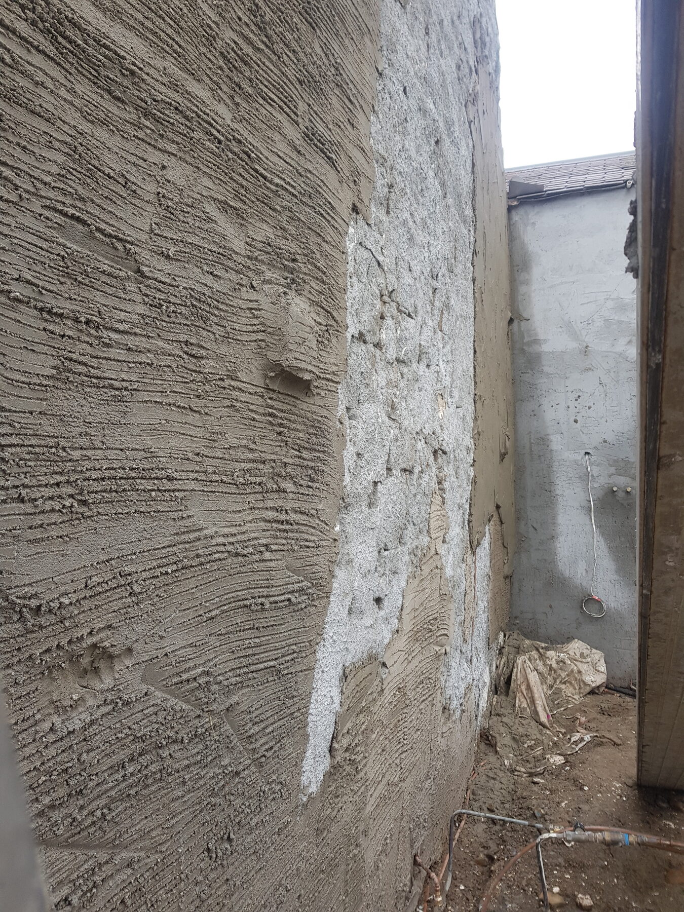 Sand and cement render being built up on Rosehill Homestead