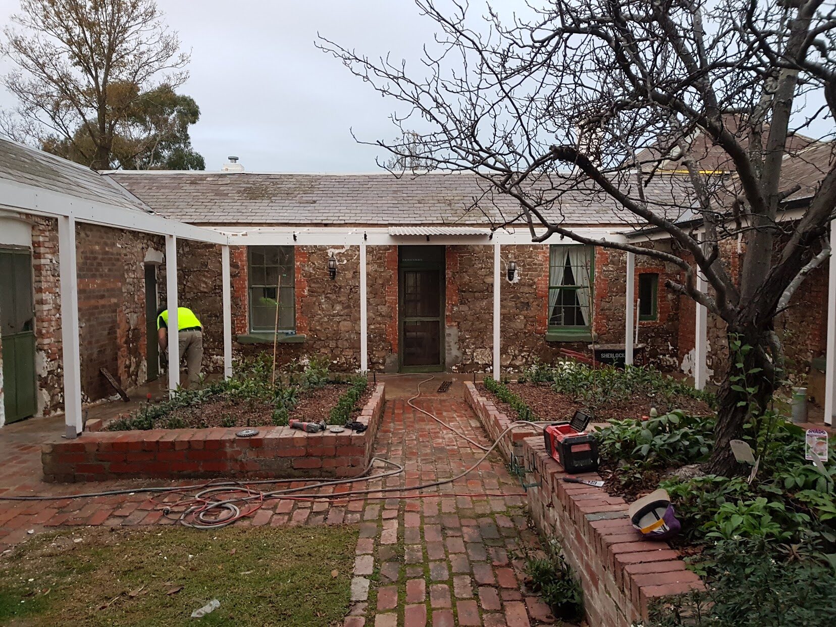 Exposed stone and brick substrate at Rosehill Homestead after render removal