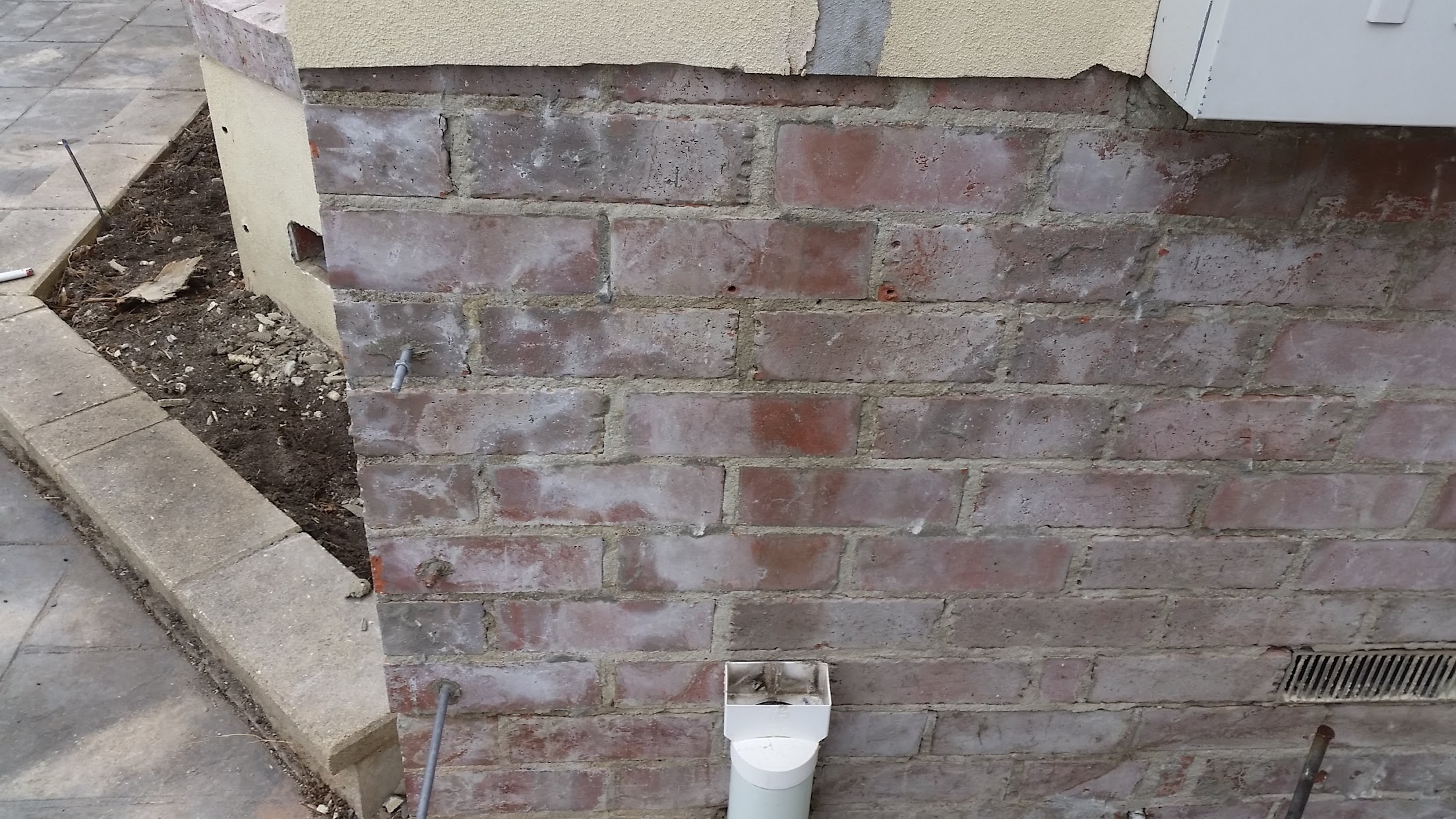 External brick corner stabilised during remedial rendering works in South Morang