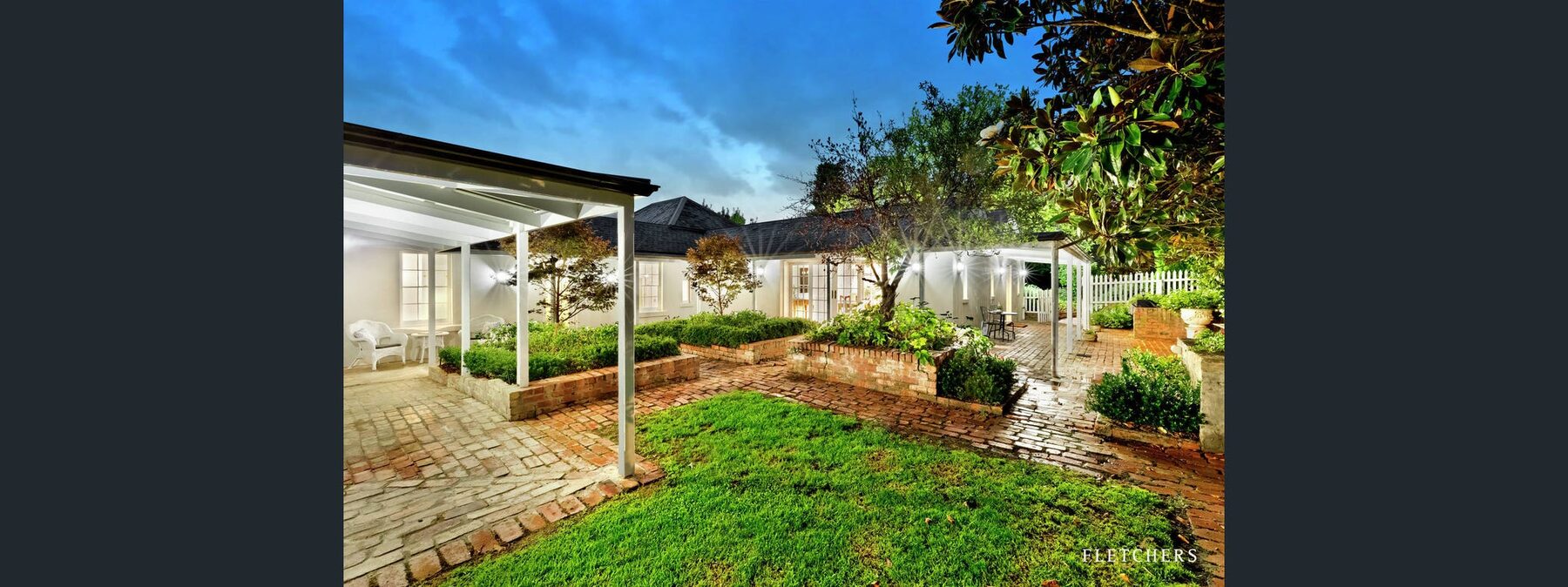 Rosehill Homestead and garden at dusk following heritage rendering restoration